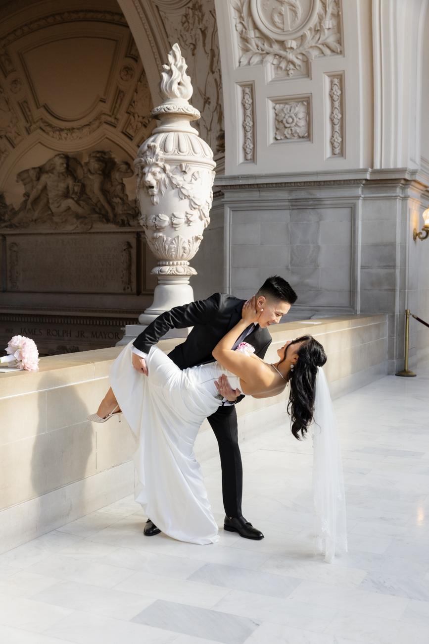 A dip kiss under the marble arches